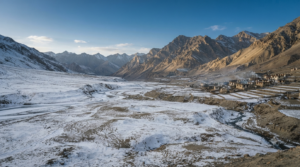 Snow-covered Langza village surrounded by Himalayan mountains in Spiti Valley - BlueJay Explorations
