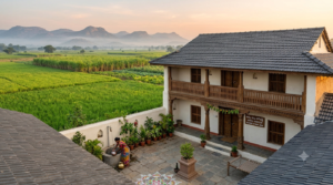 Traditional Indian village homestay surrounded by a peaceful rural landscape - BlueJay Explorations